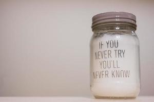 If You Never Try You Will Never Know. Candle glass. photo