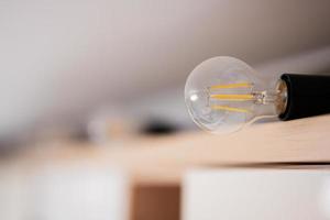 Retro Edison light bulb over white background. photo