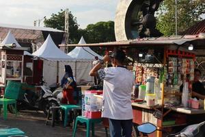 Kudus, December 2022. Photo portrait of the Kudus Expo Micro, Small and Medium Enterprises, with various kinds of clothing, food and drinks. located in the Kudus square crowded with sellers  visitors.