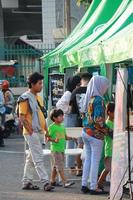 Kudus, December 2022. Photo portrait of the Kudus Expo Micro, Small and Medium Enterprises, with various kinds of clothing, food and drinks. located in the Kudus square crowded with sellers  visitors.