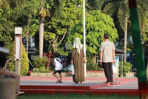 Kudus, December 2022. Photo of visitors relaxing enjoying the afternoon in the Kudus city square.