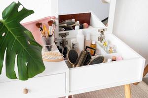 Stylish room interior with elegant dressing table and plants photo