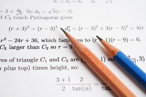 Pencil on mathematic formula exercise test paper in education school. photo