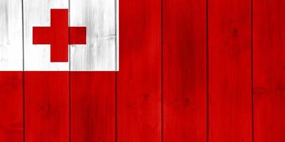 Flag of the Kingdom of Tonga on a textured background. Concept collage. photo