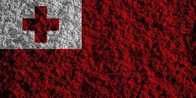 Flag of the Kingdom of Tonga on a textured background. Concept collage. photo