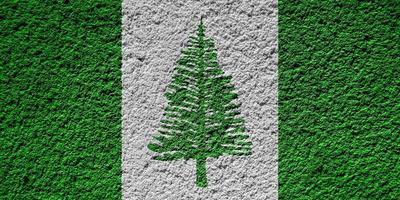 Flag of Norfolk Island on a textured background. Concept collage. photo