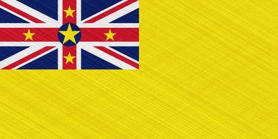 Niue flag on a textured background. Concept collage. photo
