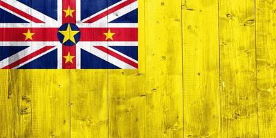 Niue flag on a textured background. Concept collage. photo