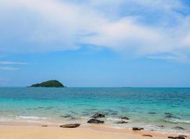 Beautiful Landscape viewpoint for design postcard and calendar  tropical rock beach front view sea blue sky overlooking Nang Ram Beach Sattahip Bay Chonburi Thailand On clear day white cloud holiday photo