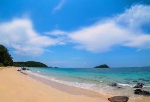 Beautiful Landscape viewpoint for design postcard and calendar  tropical rock beach front view sea blue sky overlooking Nang Ram Beach Sattahip Bay Chonburi Thailand On clear day white cloud holiday photo