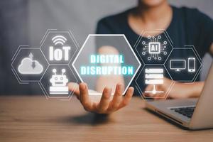 Digital disruption concept, Business person hand holding digital disruption icon on virtual screen, internet of things, network, smart city and machines, big data, cloud, analytics. photo