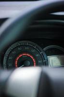 Closeup car fuel gauge dashboard panel. Gasoline indicator meter and speedometer. Fuel gauge show full gas tank. Data information dashboard photo