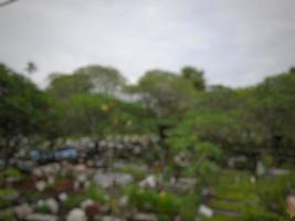 Defocused abstract blurred background of public cemetery photo