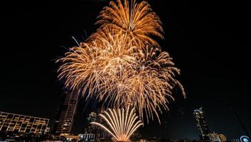 fireworks on the river in the dark sky photo