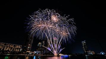 fireworks on the river in the dark sky photo