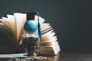 Graduation cap with Earth globe. Concept of global business study, abroad educational, Back to School. Education in Global world, Study abroad business in universities in worldwide. language study photo