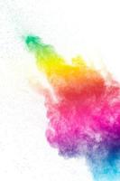 Colorful background of pastel powder explosion.Rainbow color dust splash on white background. photo