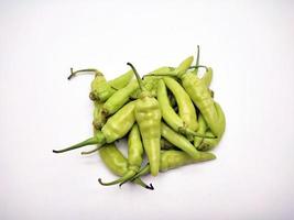 Some of light green chilies pepper isolated on white background photo