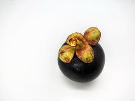 Mangosteen fruit, view from top, isolated on white background photo