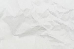 Wrinkled or crumpled white stencil paper or tissue after use in toilet or restroom with large copy space used for background texture in decorative art work photo