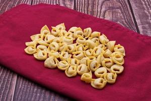 Raw Tortellini Pasta. Traditional Italian Pasta from Emilia-Romagna photo