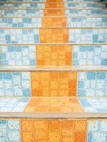Closeup of the tile pattern on the staircase. photo