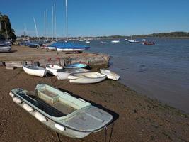 Boats on the sand at Waldringfield sailing club photo