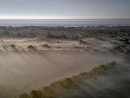 Long shadows in early morning mist photo