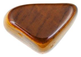 tumbled tiger-eye gemstone isolated on white photo