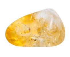 pebble of citrine mineral gem stone isolated photo