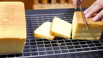 lady is cutting butter cake, people with home bakery concept video