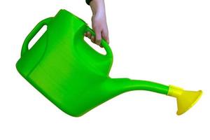 watering can green and yellow for flowers on white isolated background photo
