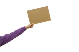 Woman's hand holding blank banner mock up on wood stick isolated. Empty board plank with space for shouting text rule or protest word. photo