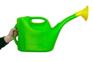 watering can green and yellow for flowers on white isolated background photo