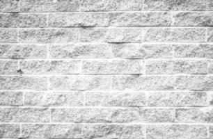 Full frame shot of white concrete wall textured and background. A concrete wall is a wall constructed of concrete blocks of uniform size. photo