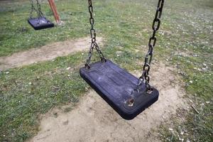 Swings in a playground photo