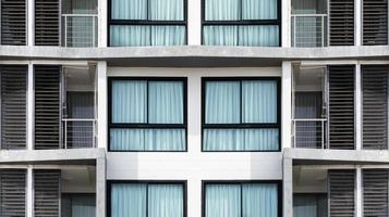 Pattern glass window on modern white building photo