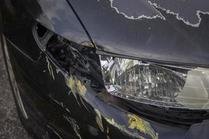 black sedan after front side swipe photo