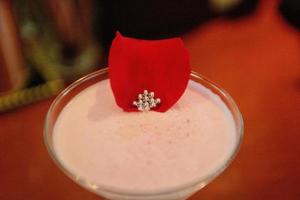 Berry martini with a rose petal photo