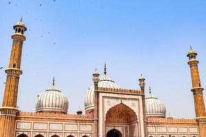 Delhi, India -April 15, 2022 - Unidentified Indian tourists visiting Jama Masjid during Ramzan season, in Delhi 6, India. Jama Masjid is the largest and perhaps the most magnificent mosque in India photo