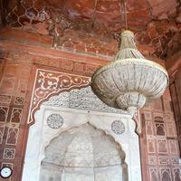 Delhi, India -April 15, 2022 - Unidentified Indian tourists visiting Jama Masjid during Ramzan season, in Delhi 6, India. Jama Masjid is the largest and perhaps the most magnificent mosque in India photo