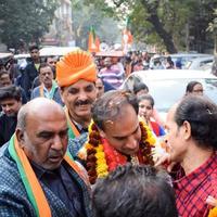 Delhi, India, December 02 2022 -Bharatiya Janata Party BJP supporter during mega road show in support of BJP candidate Pankaj Luthara to file nomination papers ahead of MCD local body Elections 2022 photo