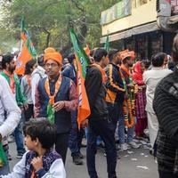 Delhi, India, December 02 2022 -Bharatiya Janata Party BJP supporter during mega road show in support of BJP candidate Pankaj Luthara to file nomination papers ahead of MCD local body Elections 2022 photo