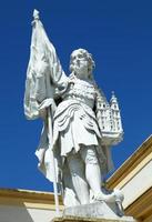 The Sculpture With A Monastery In A Hand At The Entrance to Historic Melk Abbey photo