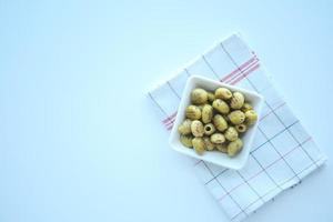 Turkish Grilled olives with olive on white background photo