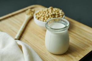 soy milk pouring in a glass jar photo
