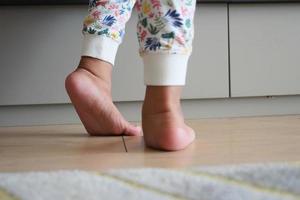 low angle view of A child walking on tiptoes photo