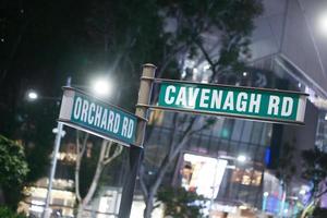 orchard road sign and buildings photo