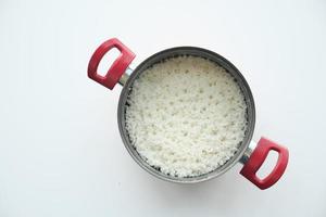 cooked rice in a bowl on white background . photo