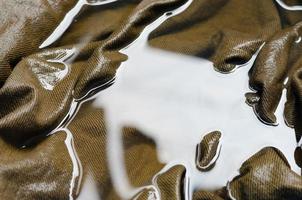 Brown Denim Fabric in Water for Washing for Abstract Background photo